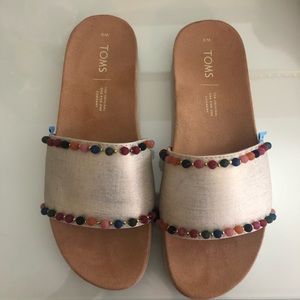 TOMS shimmer gold sandals w Pom poms